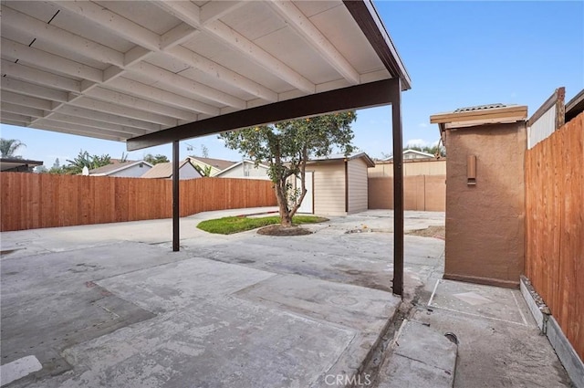 view of patio / terrace featuring a storage unit