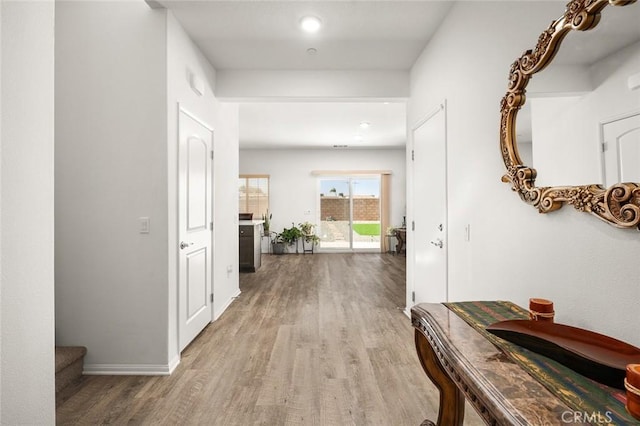 hallway featuring light wood-type flooring