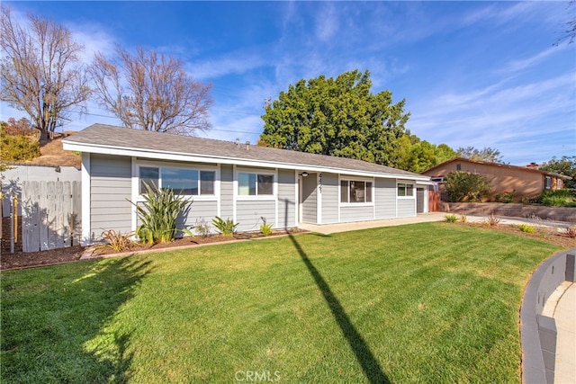 single story home featuring a front lawn