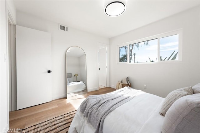 bedroom with light hardwood / wood-style floors