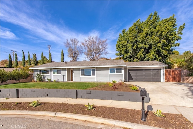 ranch-style home with a front yard and a garage