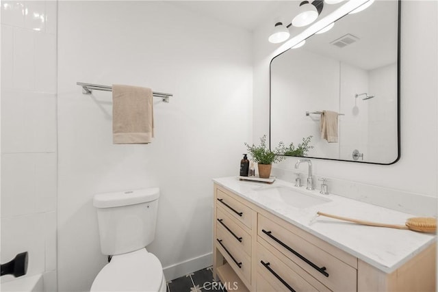 bathroom with toilet and vanity