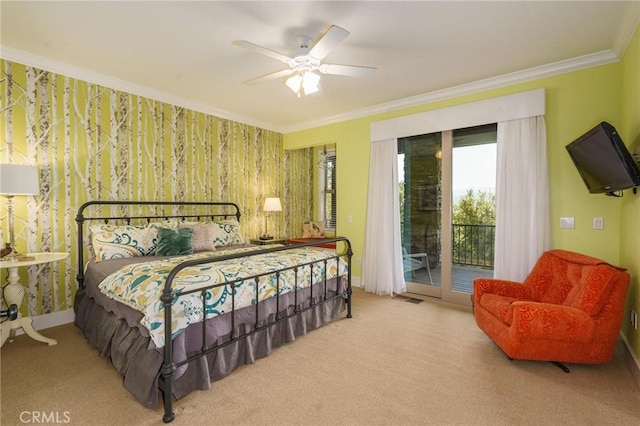 bedroom with ceiling fan, access to exterior, light colored carpet, and crown molding