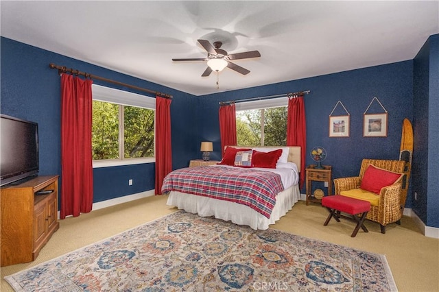 carpeted bedroom featuring ceiling fan