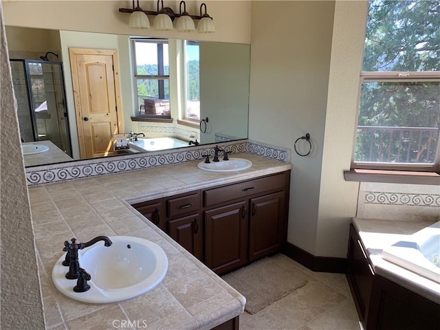 bathroom featuring tile patterned floors, walk in shower, and vanity