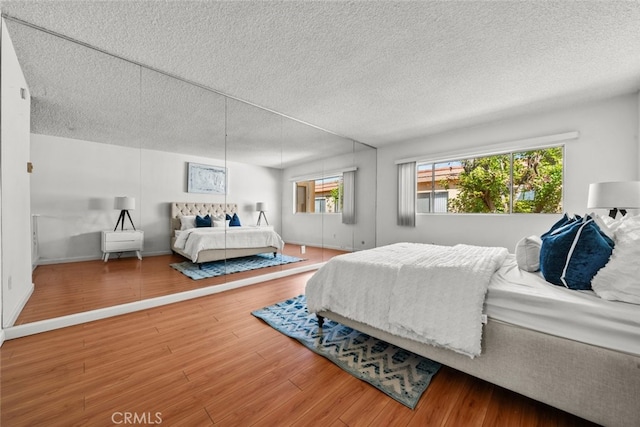 bedroom with hardwood / wood-style floors