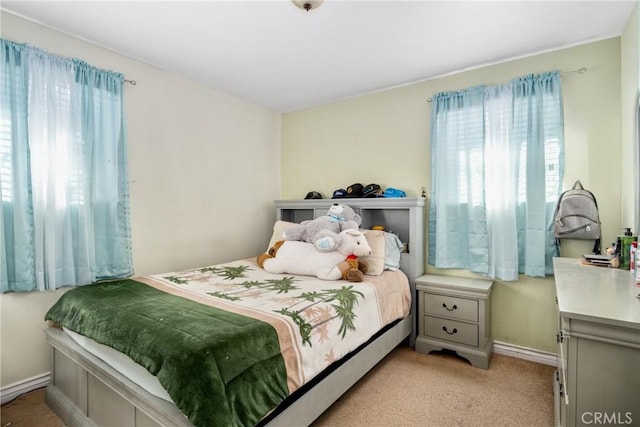 bedroom with light colored carpet