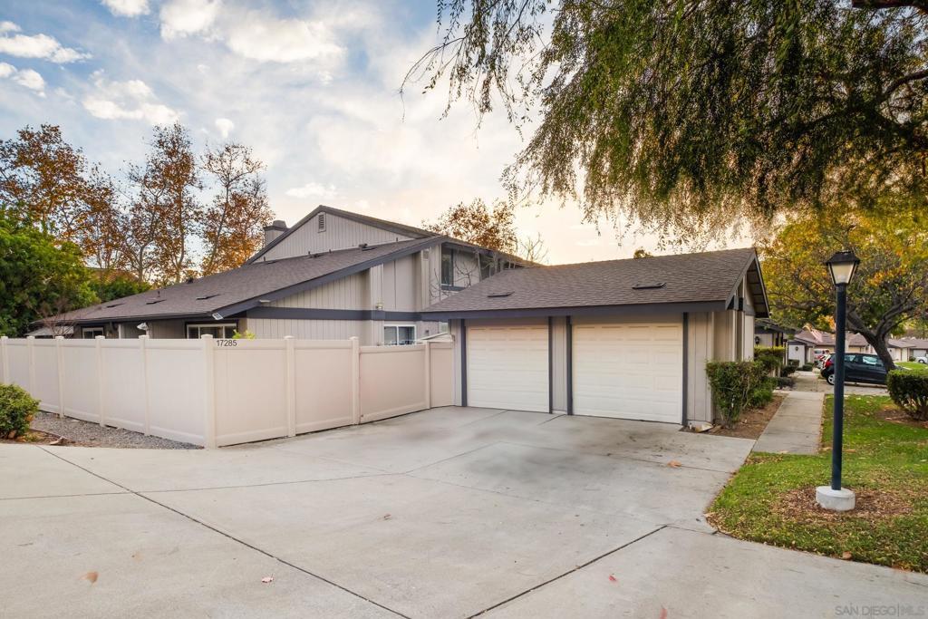 view of side of property with a garage and an outdoor structure