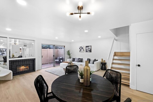 dining area featuring ceiling fan and light hardwood / wood-style flooring