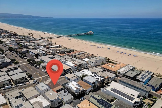 birds eye view of property featuring a beach view and a water view