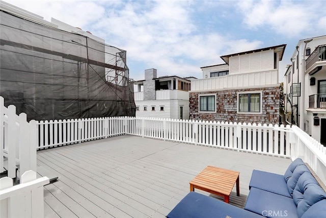 wooden deck featuring outdoor lounge area