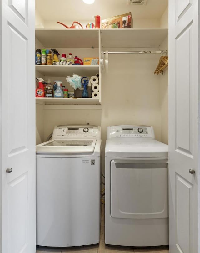 washroom with separate washer and dryer