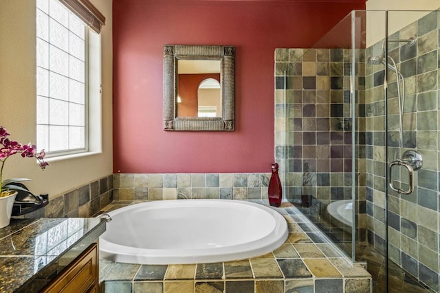 bathroom featuring walk in shower and plenty of natural light