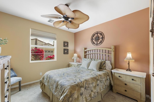 bedroom featuring light carpet and ceiling fan