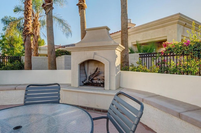 view of patio / terrace featuring a tile fireplace