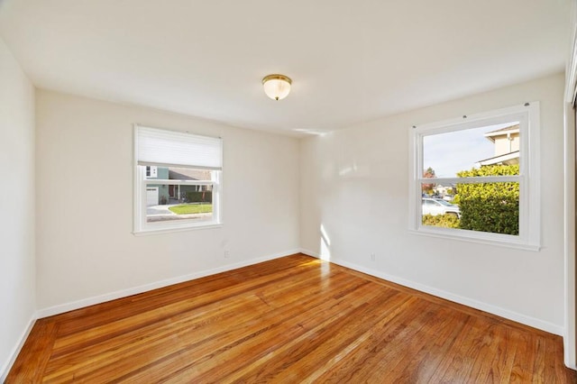 spare room featuring hardwood / wood-style flooring