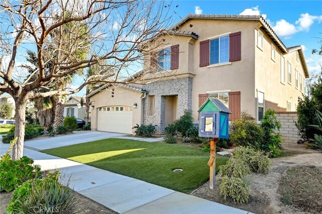 mediterranean / spanish house featuring a garage and a front lawn