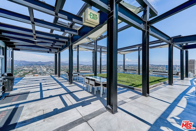 view of patio with a mountain view and a pergola