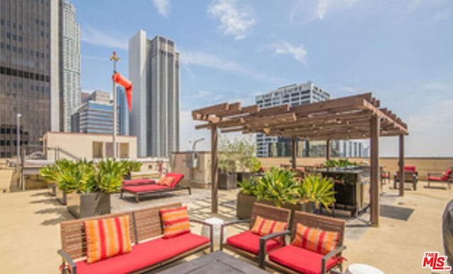 view of patio with outdoor lounge area and a pergola