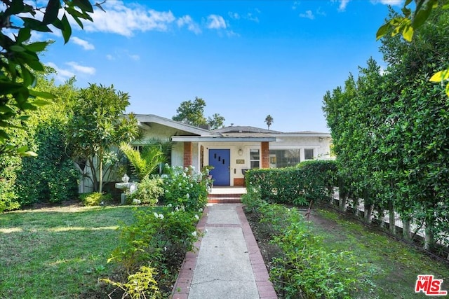 view of front of house with a front yard