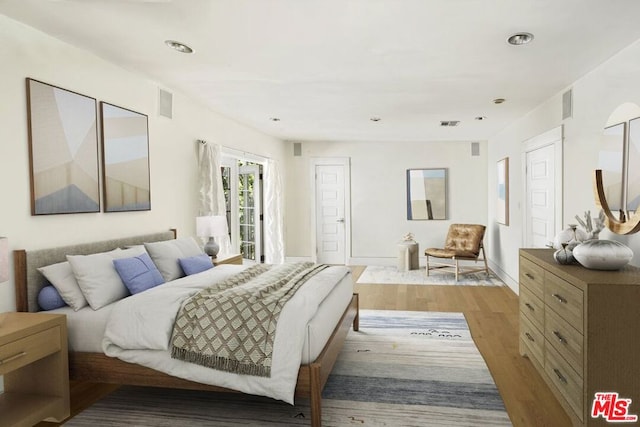 bedroom with light hardwood / wood-style floors