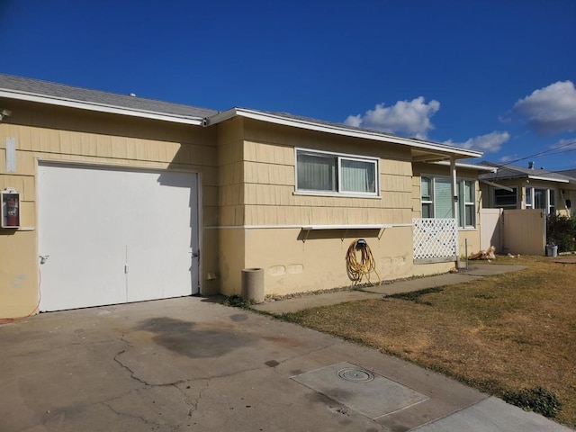 view of side of home featuring electric panel