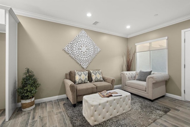 living room featuring crown molding