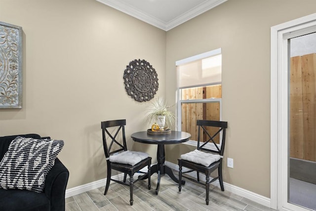 dining area featuring crown molding