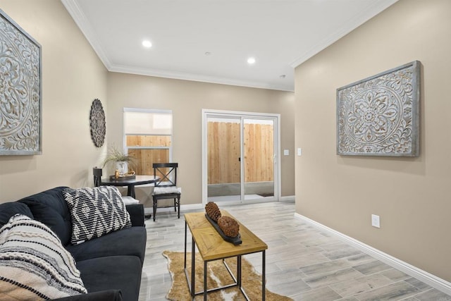 living room with crown molding and light hardwood / wood-style floors