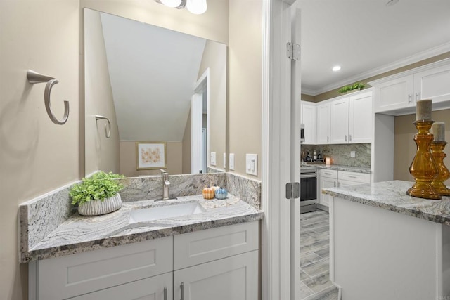 bathroom with decorative backsplash, wood-type flooring, and sink