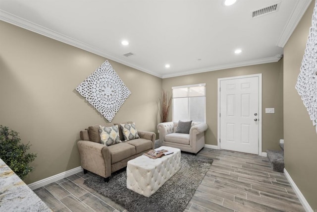 living room with hardwood / wood-style floors and ornamental molding