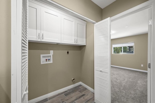 laundry area with cabinets, hardwood / wood-style floors, hookup for a washing machine, and hookup for an electric dryer