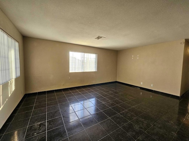 empty room with a textured ceiling