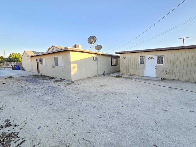 back of property with a patio area