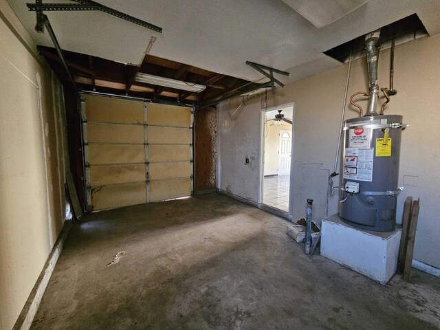 garage featuring secured water heater and ceiling fan