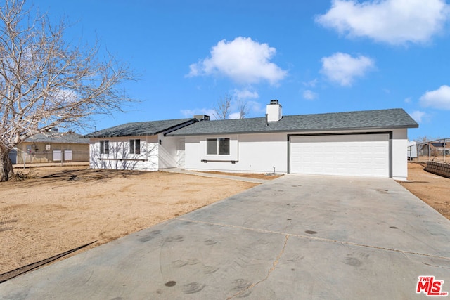 ranch-style house featuring a garage