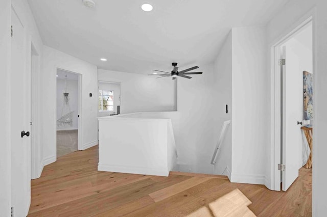 living room with ceiling fan and light wood-type flooring