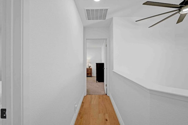 corridor featuring wood-type flooring