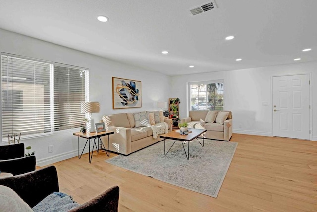 living room with light hardwood / wood-style floors