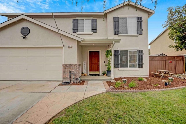 front facade featuring a garage and a front yard