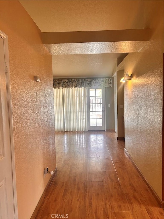 empty room featuring wood-type flooring