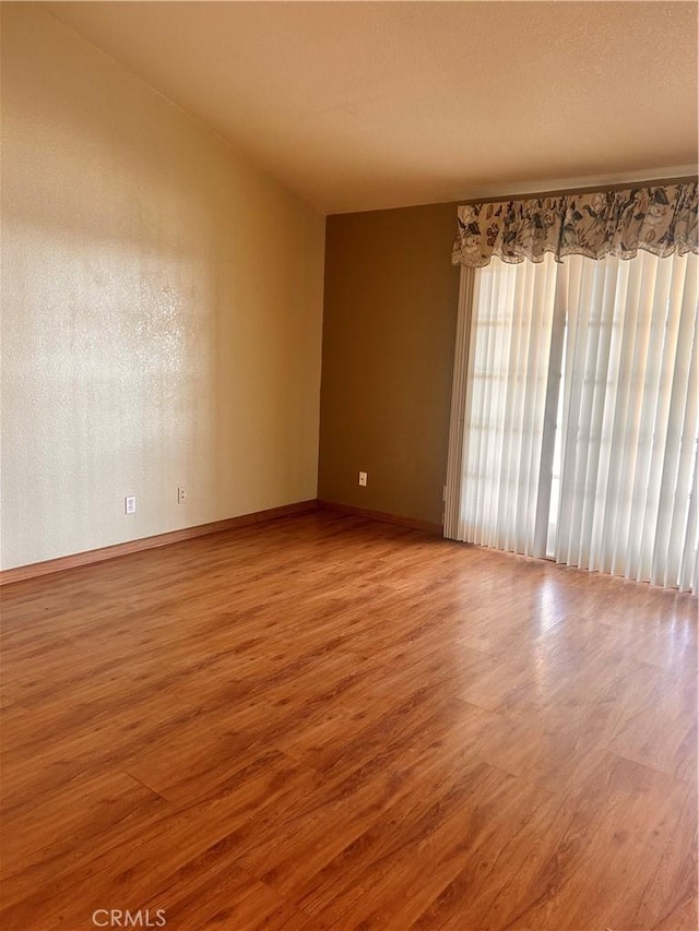 spare room featuring hardwood / wood-style floors