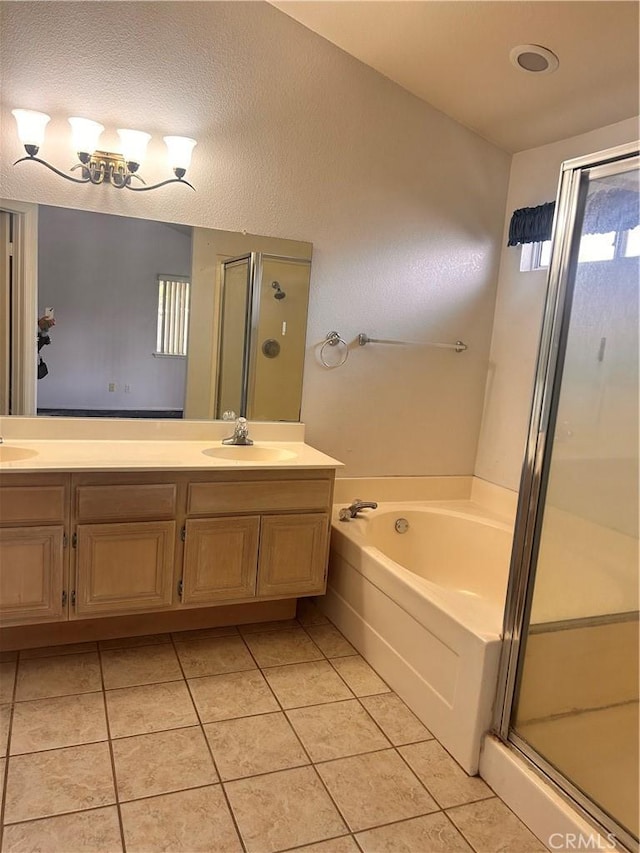 bathroom featuring vanity, tile patterned floors, and shower with separate bathtub