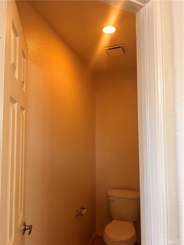 bathroom featuring toilet