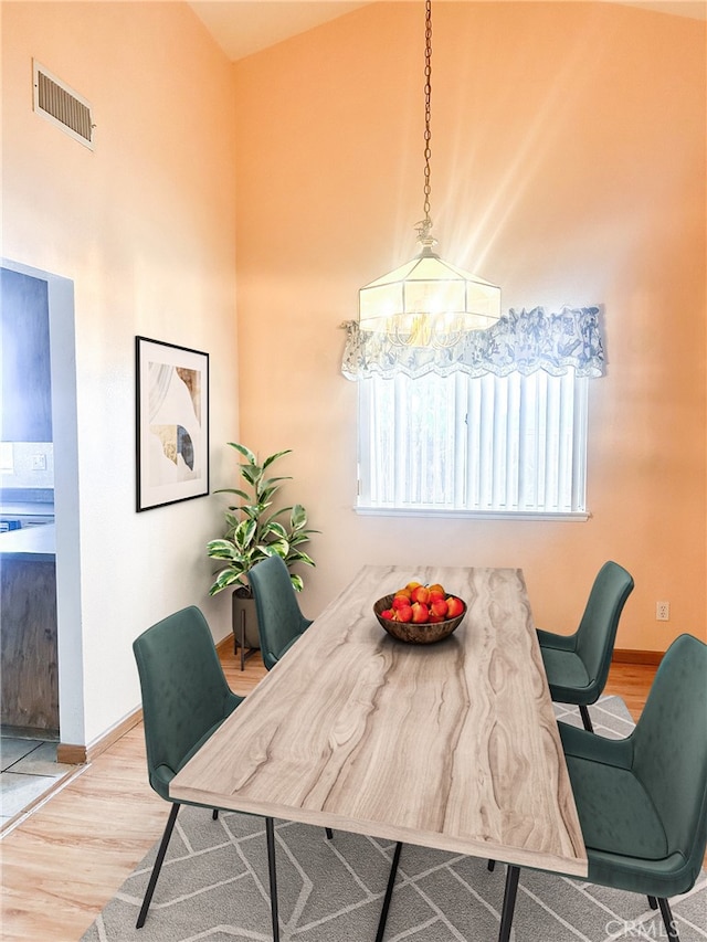 dining room featuring an inviting chandelier and hardwood / wood-style floors