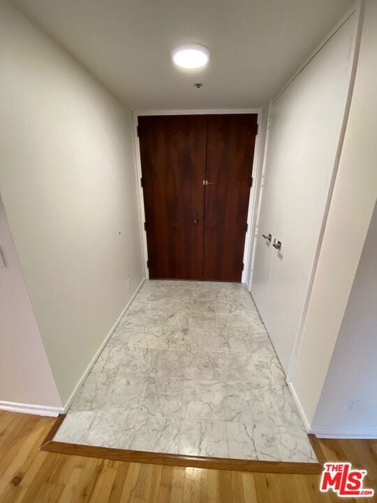 hallway featuring light hardwood / wood-style flooring