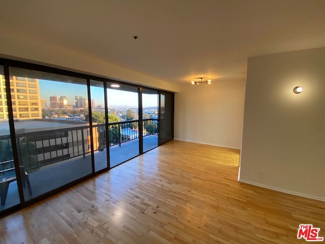 spare room featuring light hardwood / wood-style floors