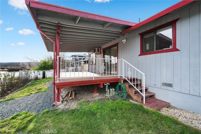 wooden terrace featuring a lawn