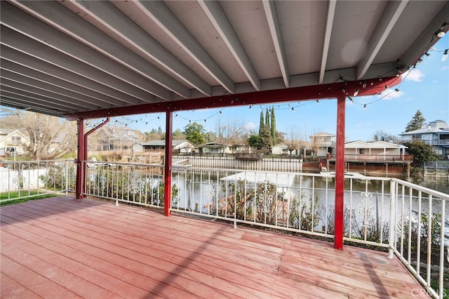 wooden deck with a water view