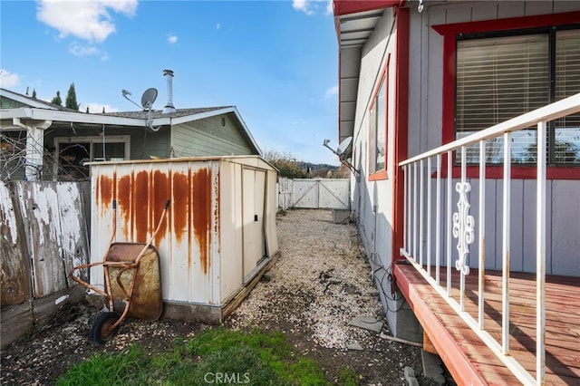 view of property exterior with a storage shed